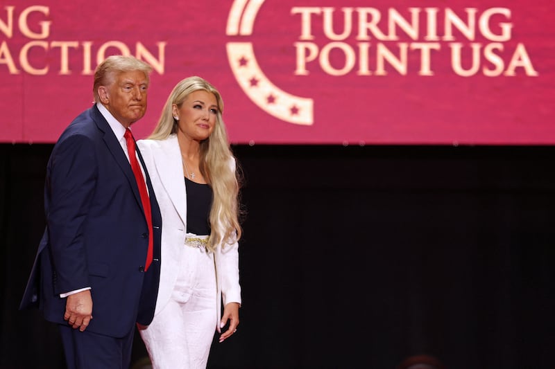 President Donald Trump greets Erika Kirk, Charlie Kirk's widow, during the public memorial service for right-wing activist Charlie Kirk at State Farm Stadium in Glendale, Arizona, on September 21, 2025.