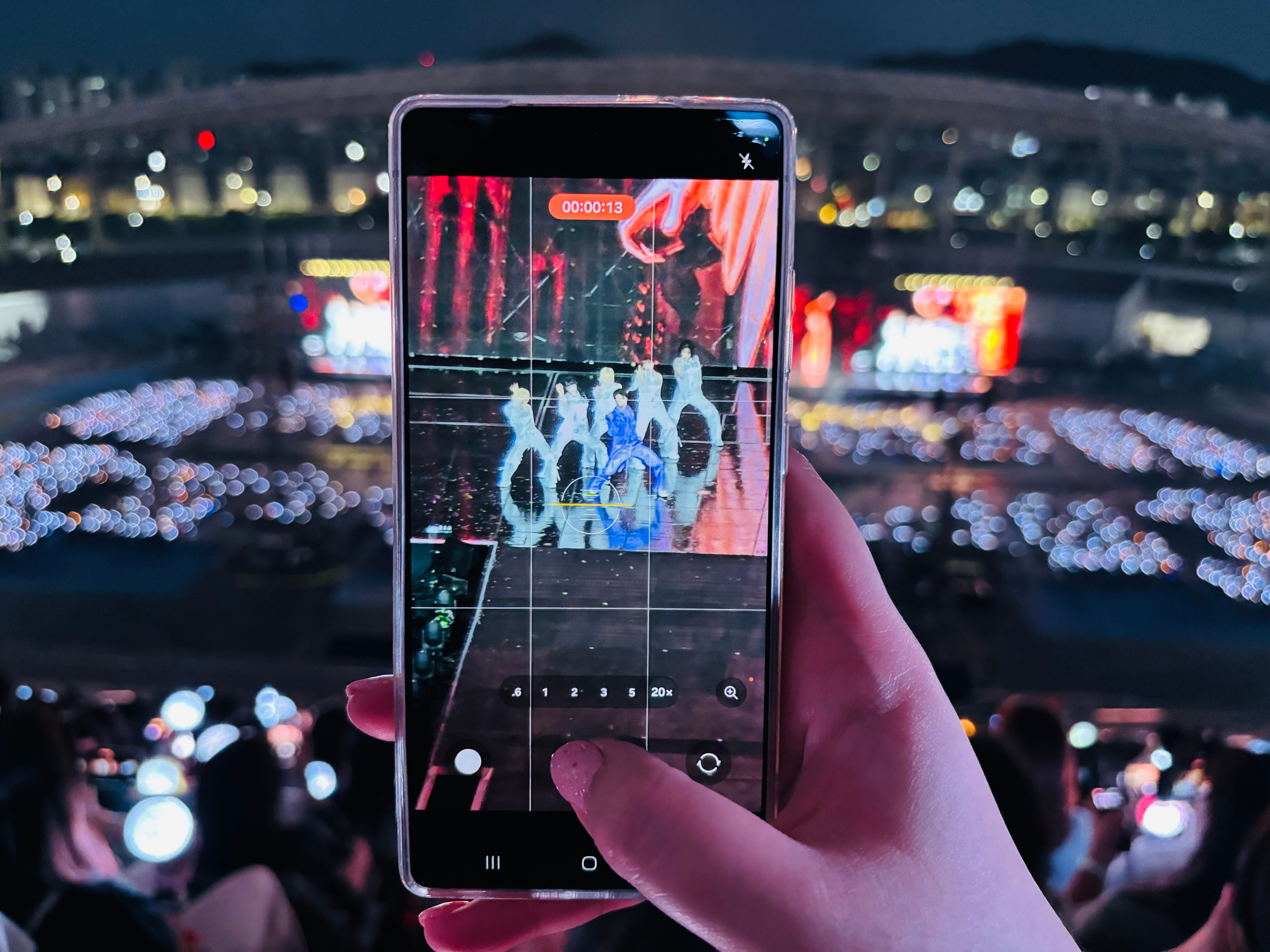 A close-up shot of a Samsung Galaxy S25 Ultra phone in action at Seventeen's K-pop concert