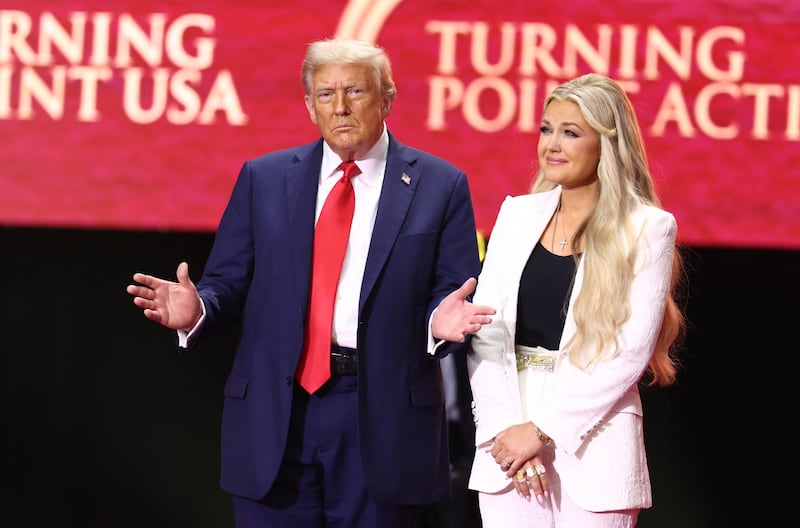 Donald Trump reacts next to Erika Kirk, widow of Charlie Kirk, after speaking at the public memorial service for right-wing activist Charlie Kirk at State Farm Stadium in Glendale, Arizona, on September 21, 2025.