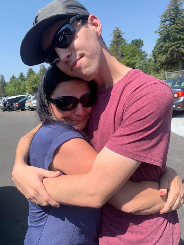 Tyler Robinson embracing his mother.