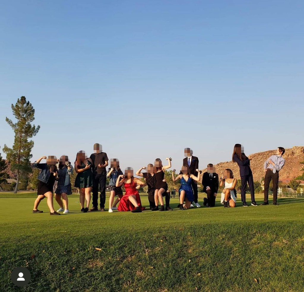 Lance Twiggs among a group of people posing on a golf course.