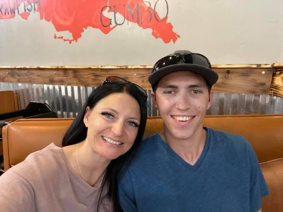 Amber and Tyler Robinson smiling for a photo.