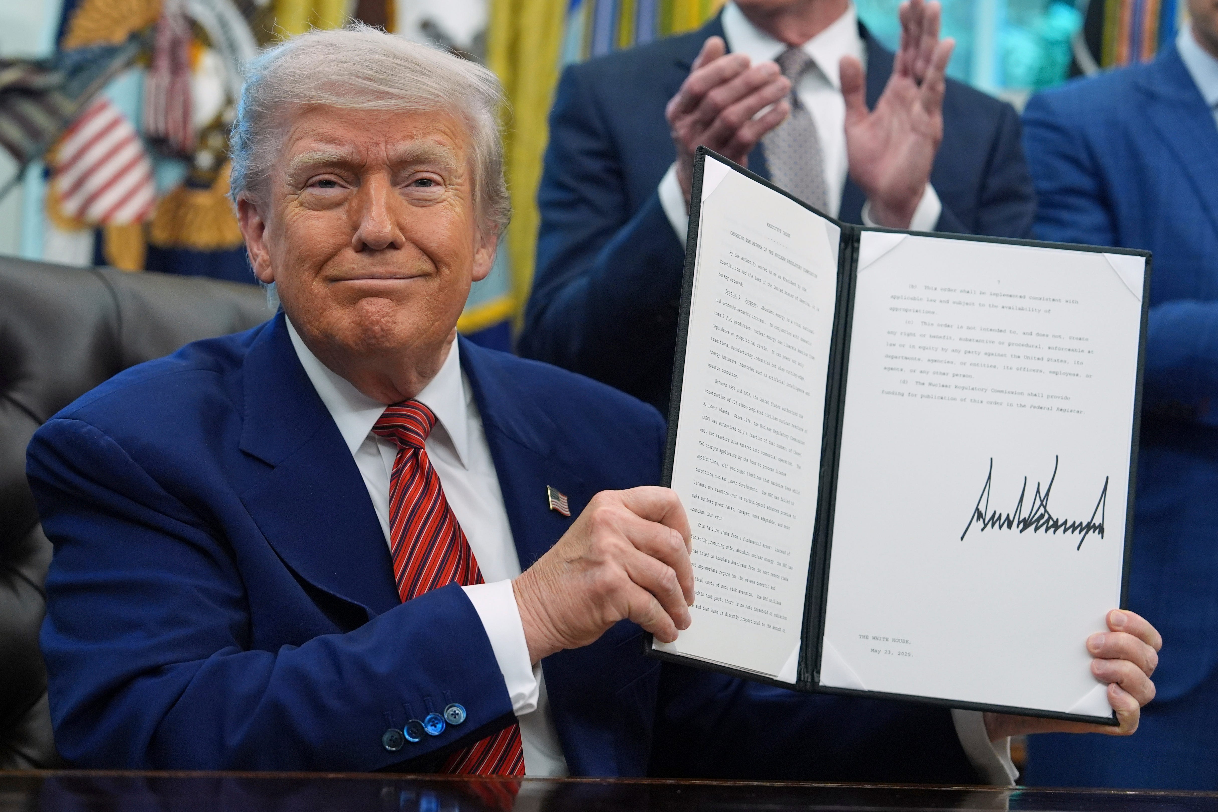 donald trump holds signed executive order