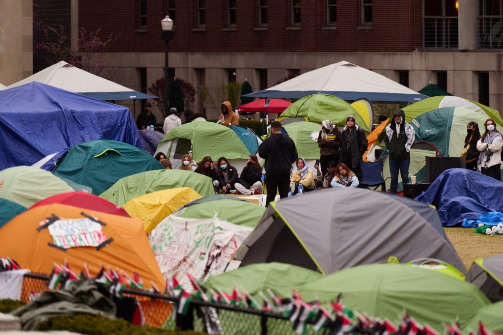 Pro-Palestinian encampment at Columbia University with many tents and people.