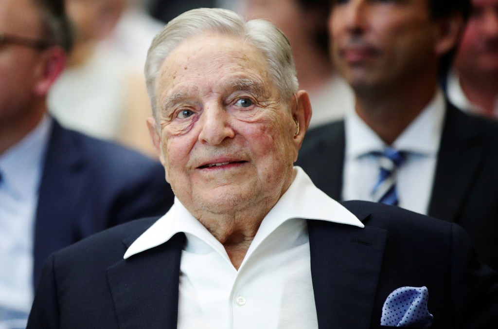 Billionaire investor George Soros smiling while attending the Schumpeter Award in Vienna.