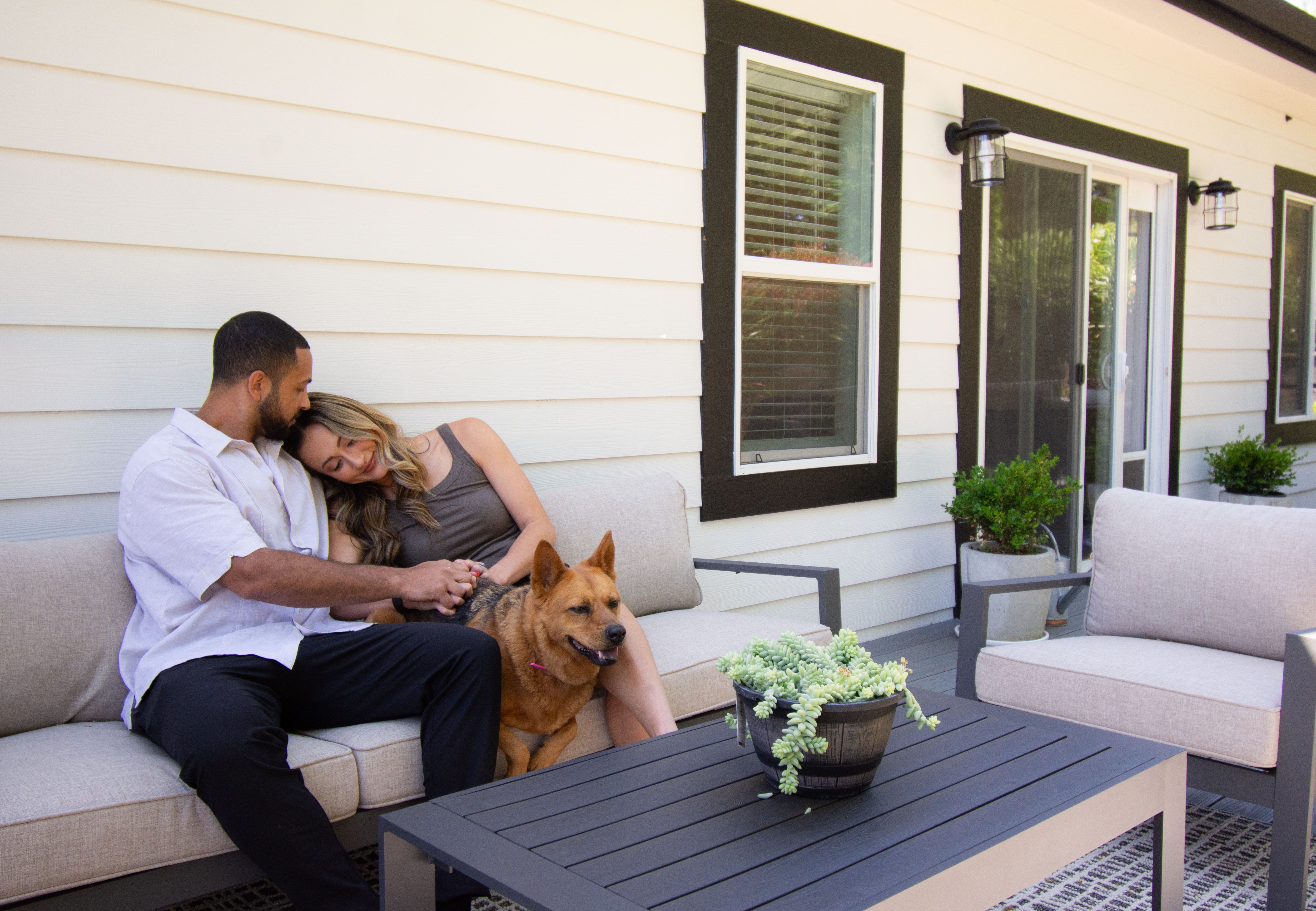 Aislyn (left) and Ali Benjamin (right) on the porch of their ADU.