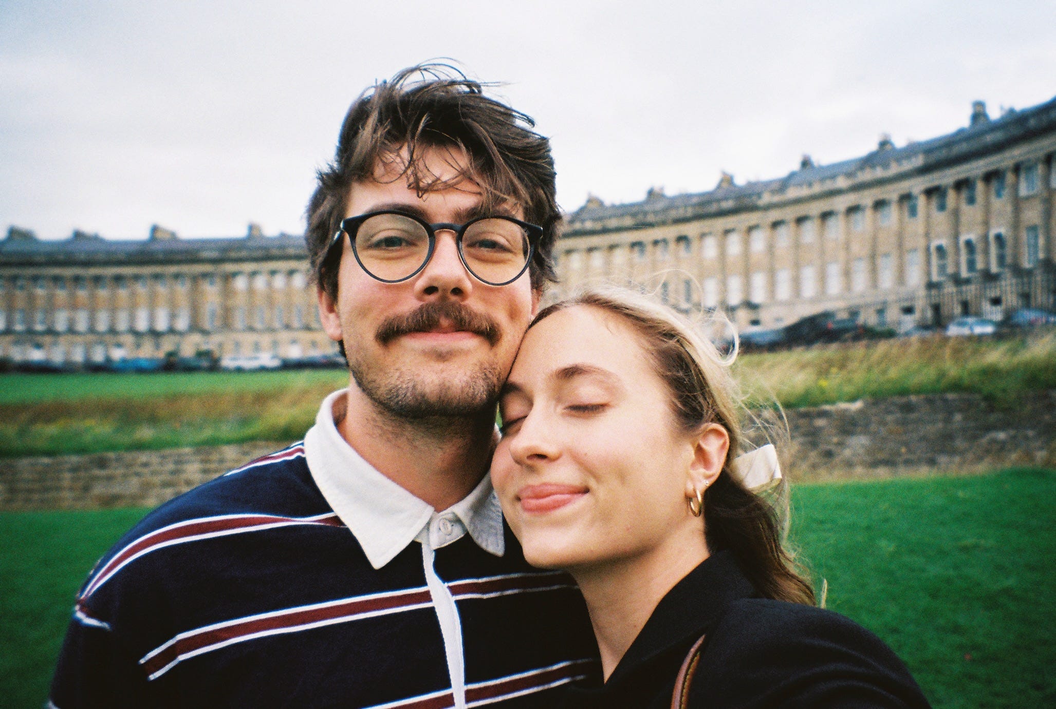 Author Tiana Molony and man with glasses smiling in selfie