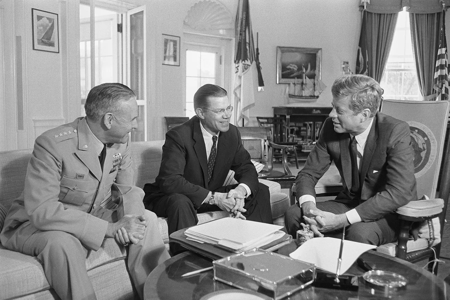 Gen. Maxwell Taylor, Chairman of the Joint Chiefs of Staff (left), and Secretary of Defense Robert McNamara (center), are shown as they met with President John F. Kennedy at the White House to give him an appraisal of the situation in Vietnam in 1963.