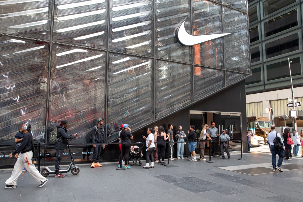 People in line at the 5th Ave Nike store waiting to purchase the Skims/Nike Kim Kardashian collection.