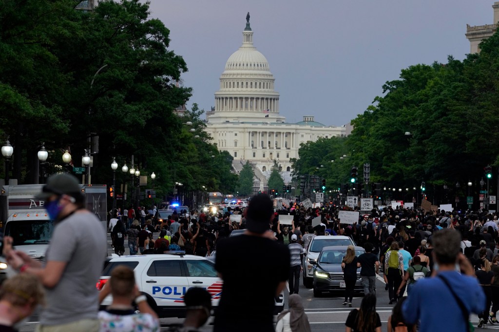 Protesters gather outside the U.S. Capitol Building.