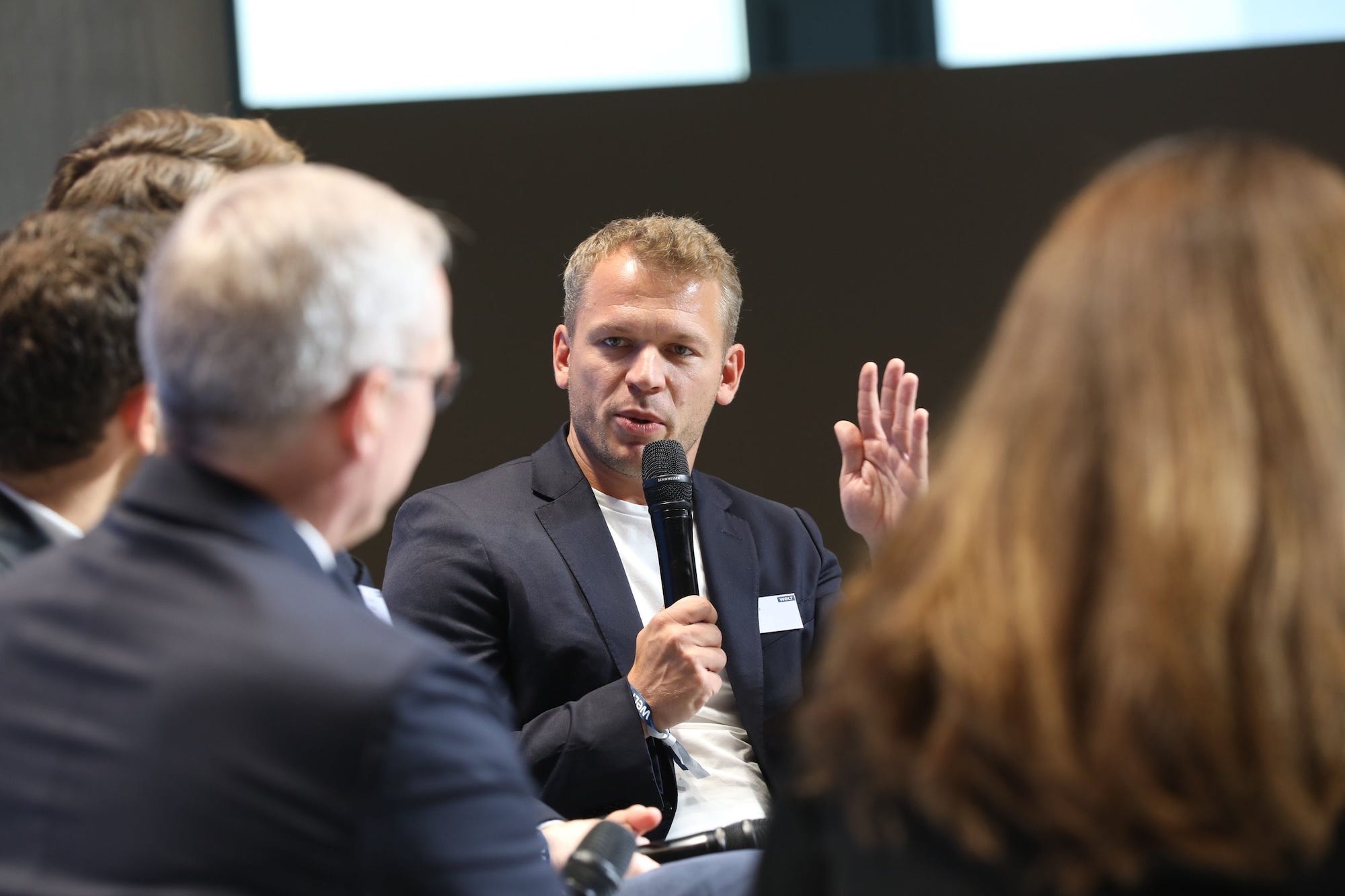 Philipp Herzig, chief technology officer and chief AI officer at SAP, talks into a microphone.