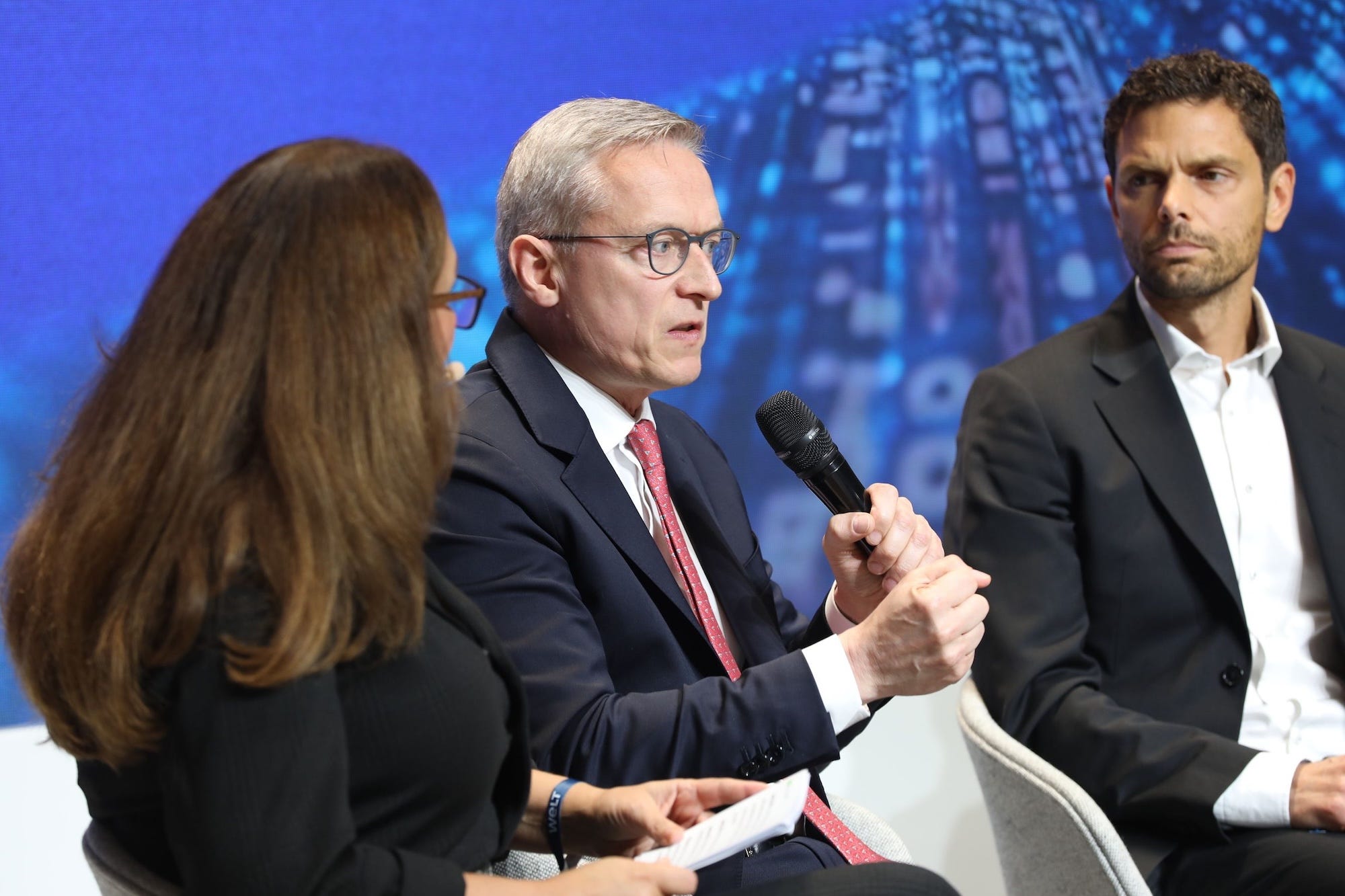 German Federal Minister Kerstner Wildberger talks into a microphone.