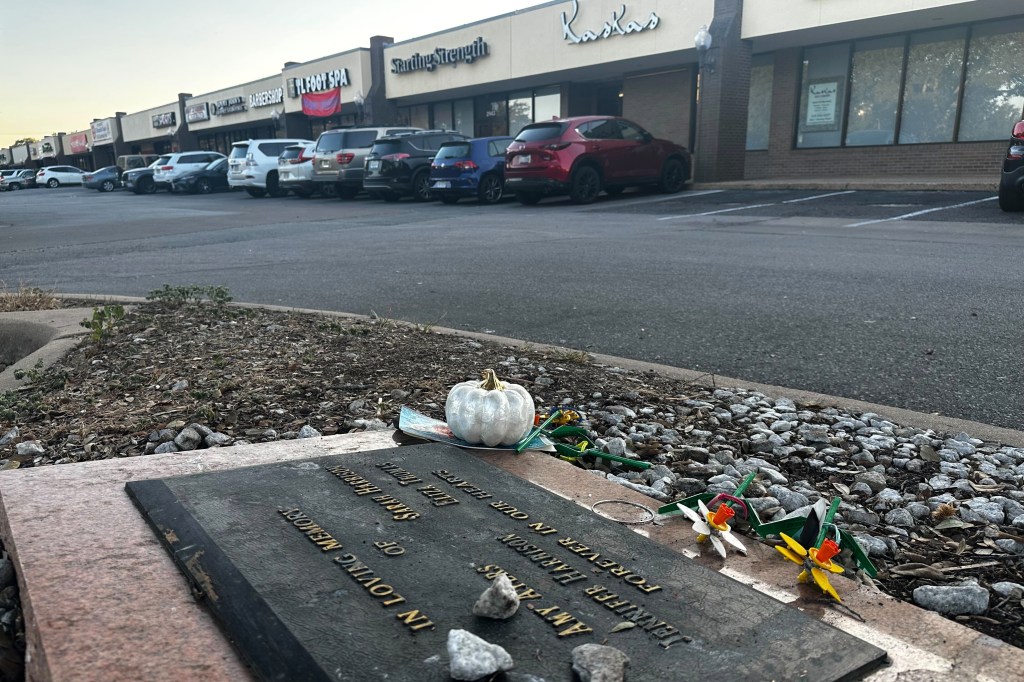 Momentos are laid at the memorial outside of a strip mall where four teen girls were killed in 1991, on Sept. 26, 2025.