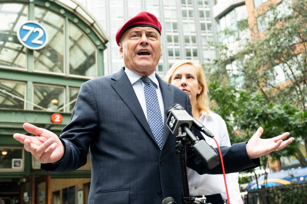 Curtis Sliwa, founder of the Guardian Angels and mayoral candidate, speaking at a press conference outside the West 72nd Street subway station.