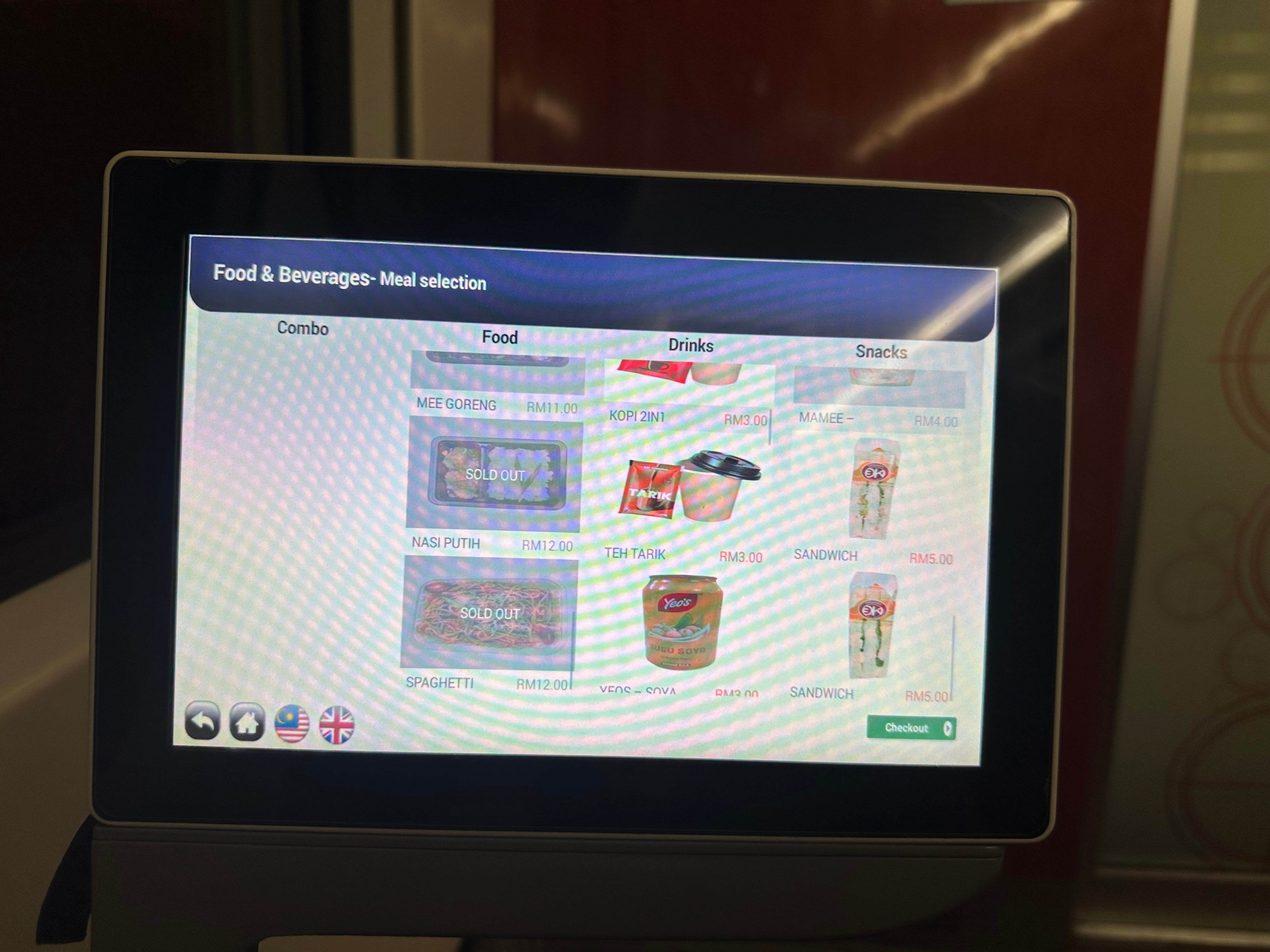 Seatback screen with food and beverages for sale on it