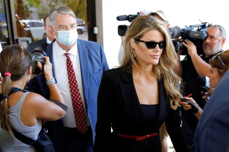 Lindsey Halligan followed by Jim Trusty, part of former U.S. President Donald Trumps legal team, leave the Paul G. Rogers Federal Building and Courthouse in West Palm Beach, Florida, on September 1, 2022. - An increasingly high-stakes standoff between Donald Trump and federal investigators lands in court, after days of headline-grabbing revelations surrounding highly classified documents seized by the FBI from the former president's Florida home. Trump's lawyers are asking that an outside party -- a 