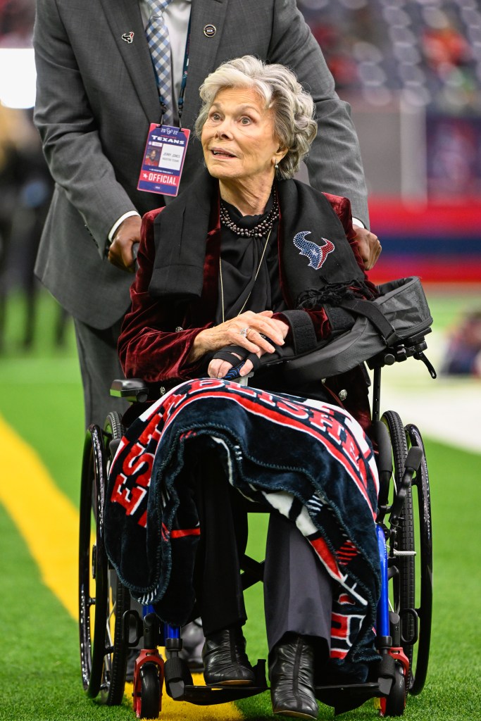 Janice Suber McNair in a wheelchair on a football field.