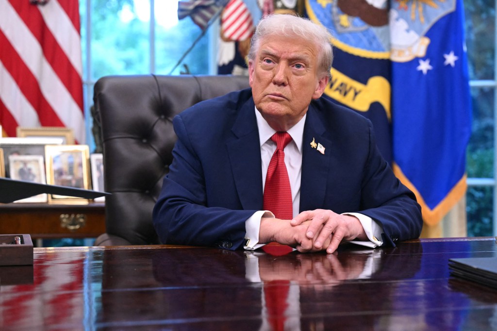 US President Donald Trump speaking to the press in the Oval Office.