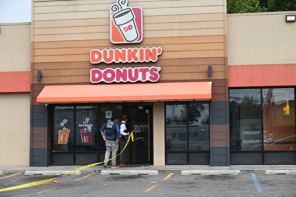 cops investigating outside of a Dunkin' Donuts where Sanjay Samuel was murdered Monday morning