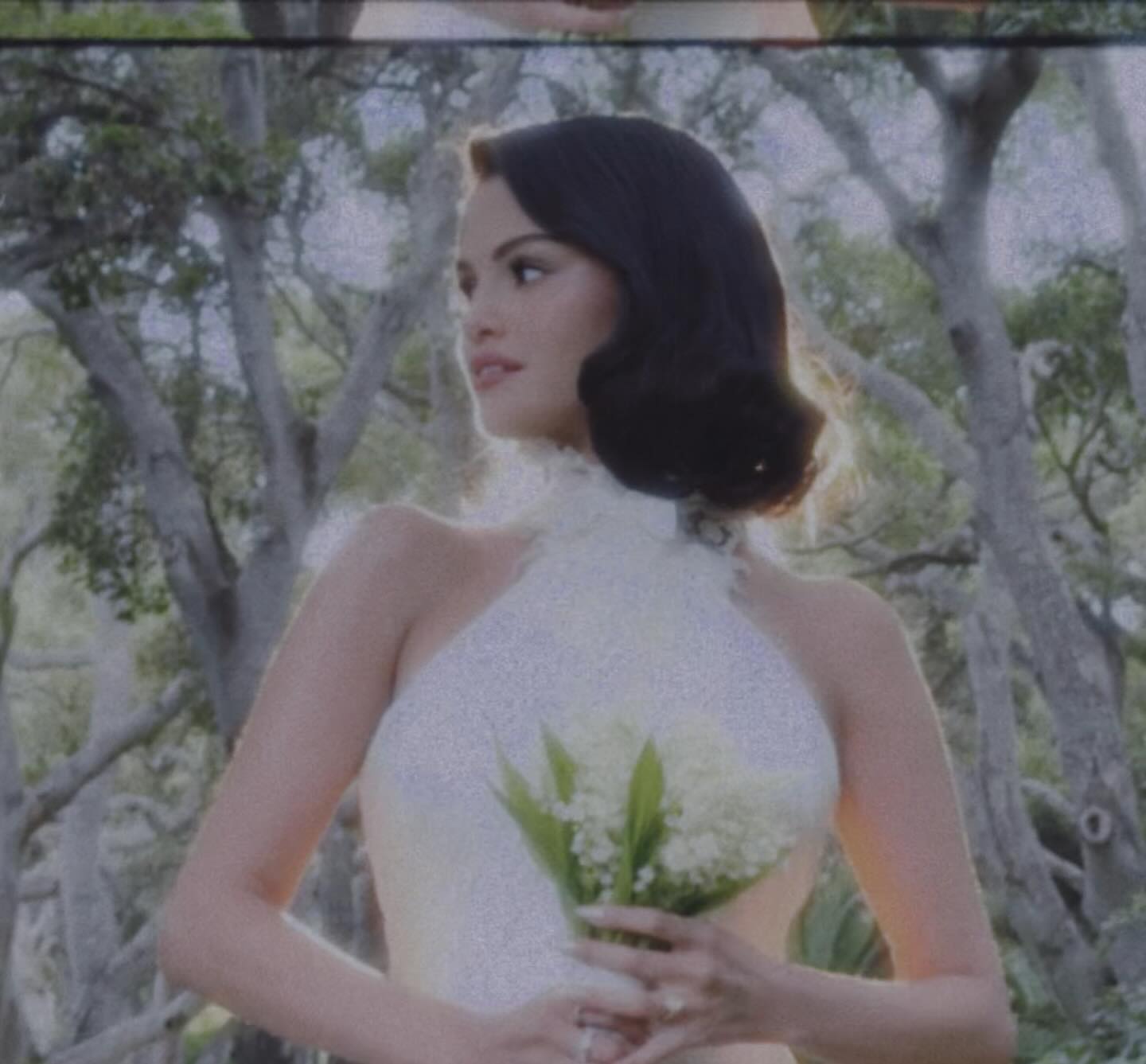 Selena Gomez in a white halter wedding dress. 