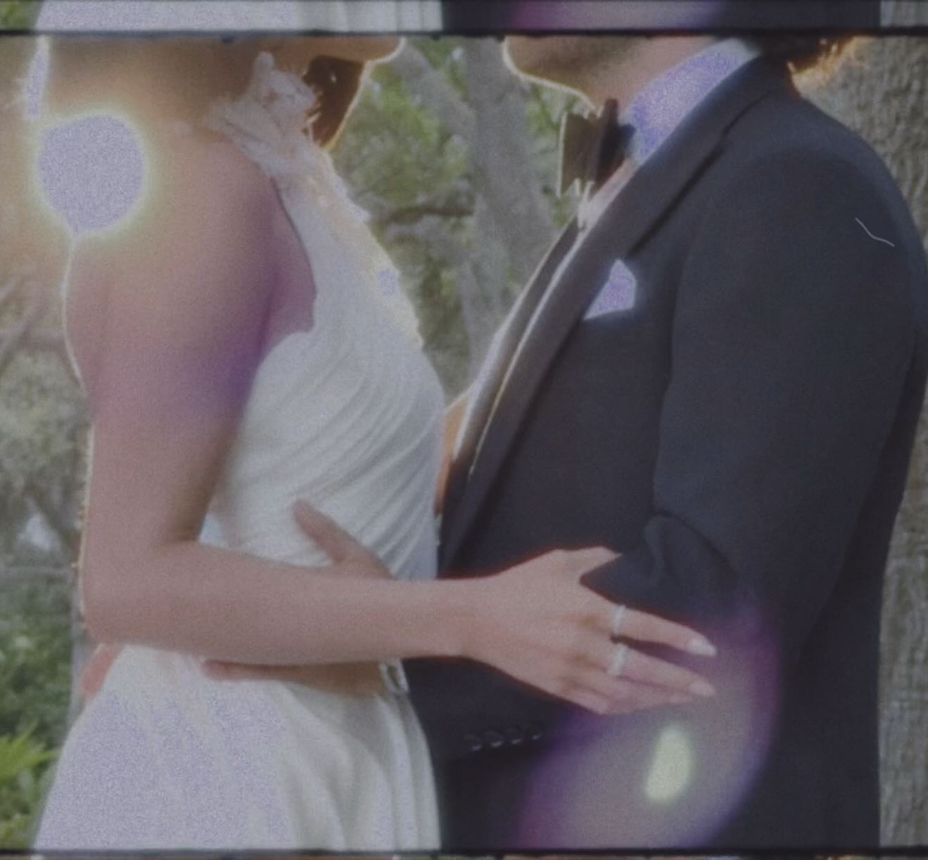 Benny Blanco and Selena Gomez in wedding outfits. 
