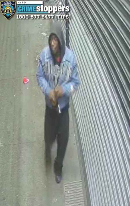 Crime Stoppers poster with a blurred image of a suspect in a hooded sweatshirt and jean jacket.