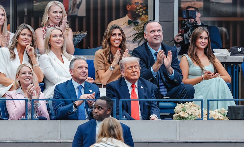 Lindsey Halligan, Karoline Leavitt, Dan Scavino, Pam Bondi, Steve Witkoff are pictured among those sitting with President Donald Trump at the U.S. Open Tennis Championships on September 7, 2025 in New York City.