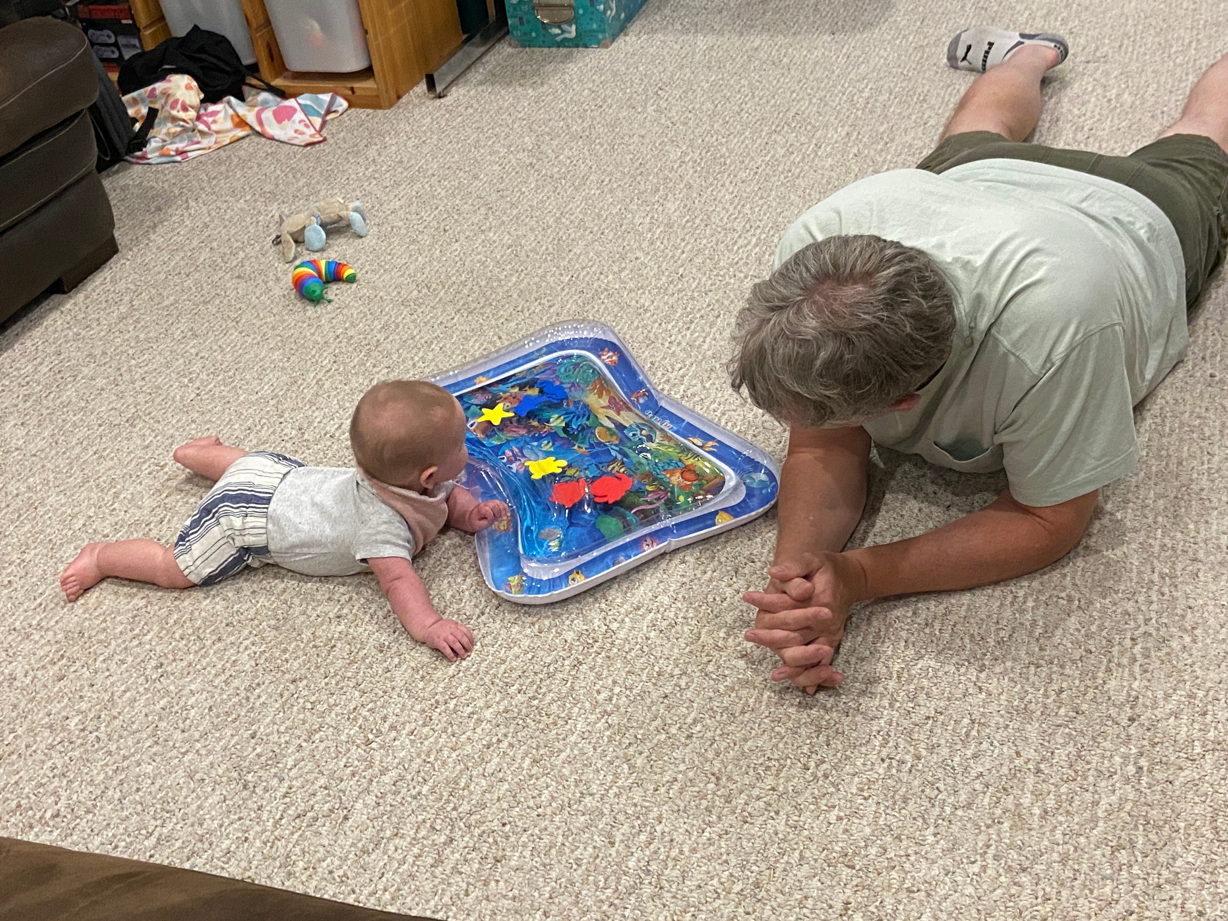The author's father playing with his granddaughter.