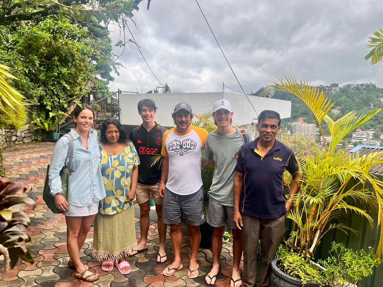 Author Ash Jurberg smiling with family in Sri Lanka