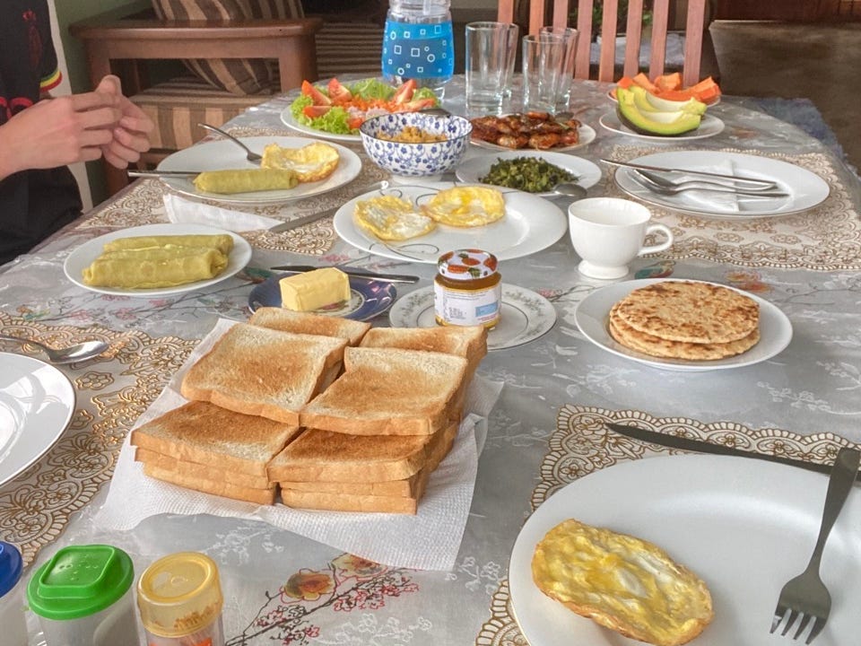 Breakfast spread on table with place settings