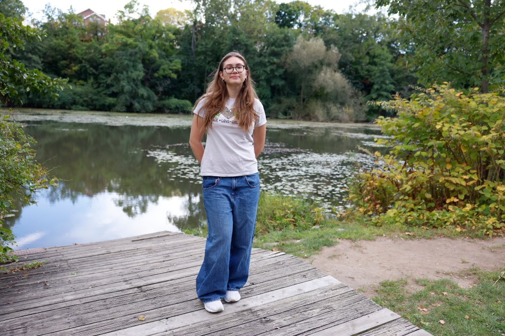 Emilia McKinney stands at the pond. 