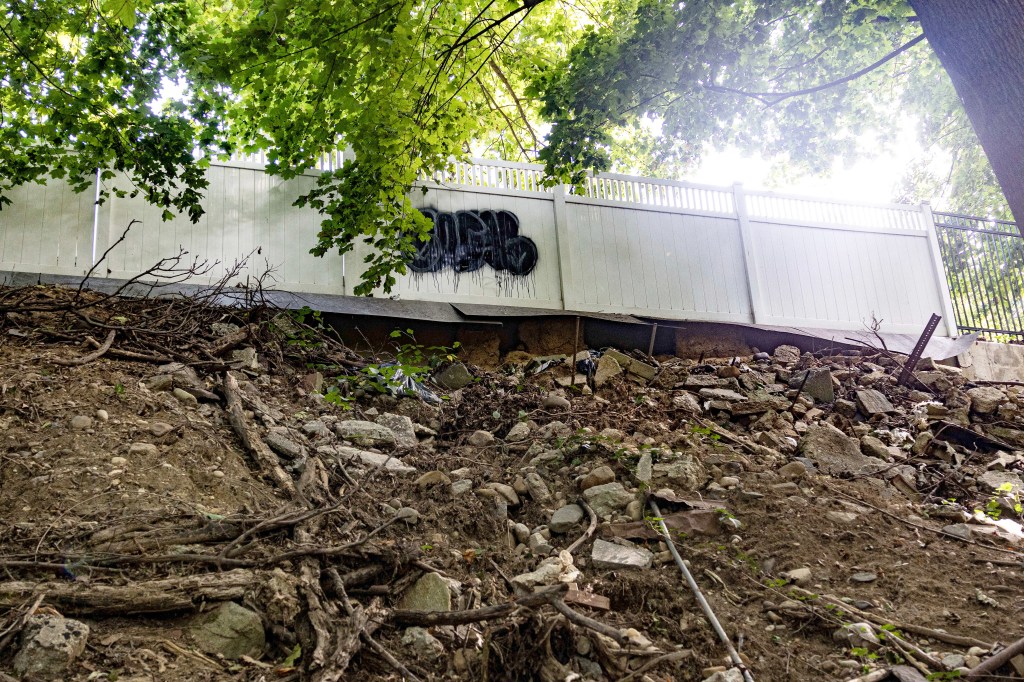 A broken retaining wall seen above Golden Pond.