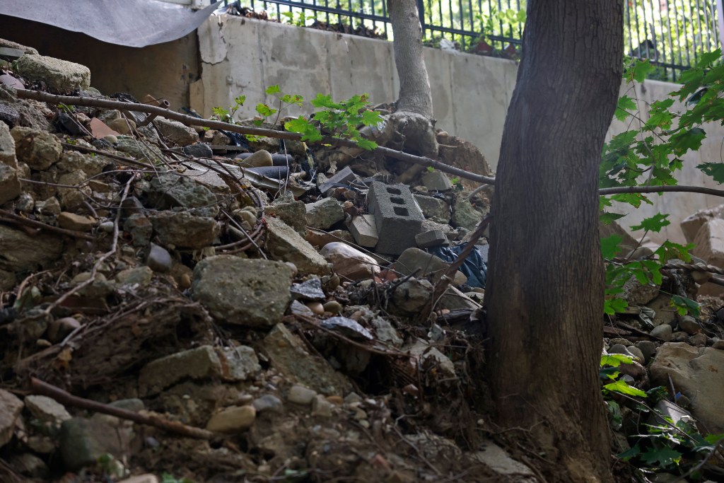 A broken retaining wall seen above Golden Pond.
