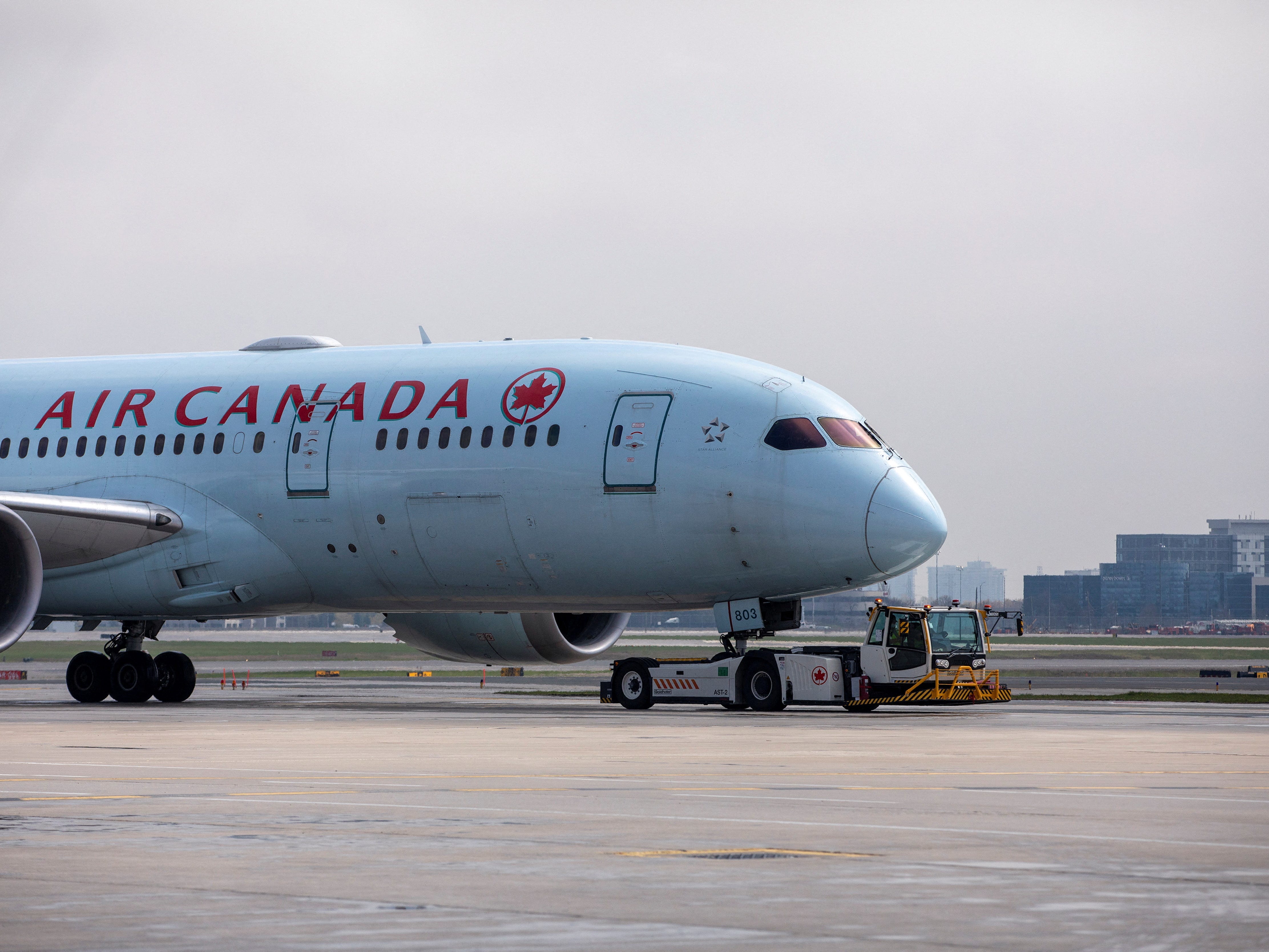 An Air Canada airplane is towed along a runway at Toronto Pearson Airport in Mississauga, Ontario, Canada April 28, 2021.