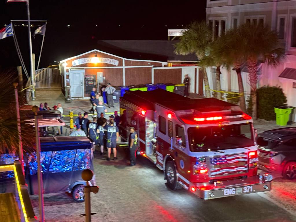 Law enforcement officials and a fire truck at the scene of a reported active shooter situation.