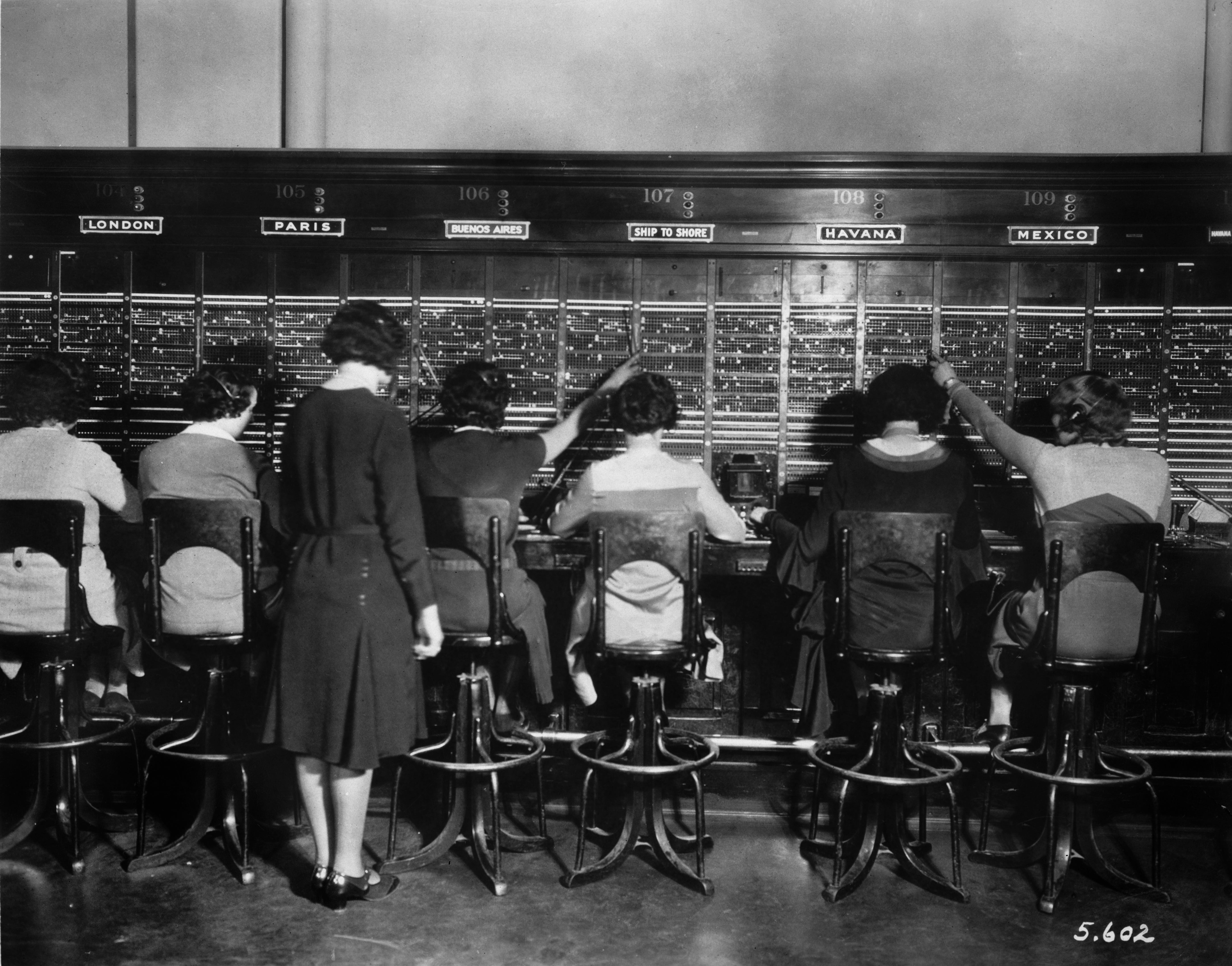 A rear view of switchboard operators at work