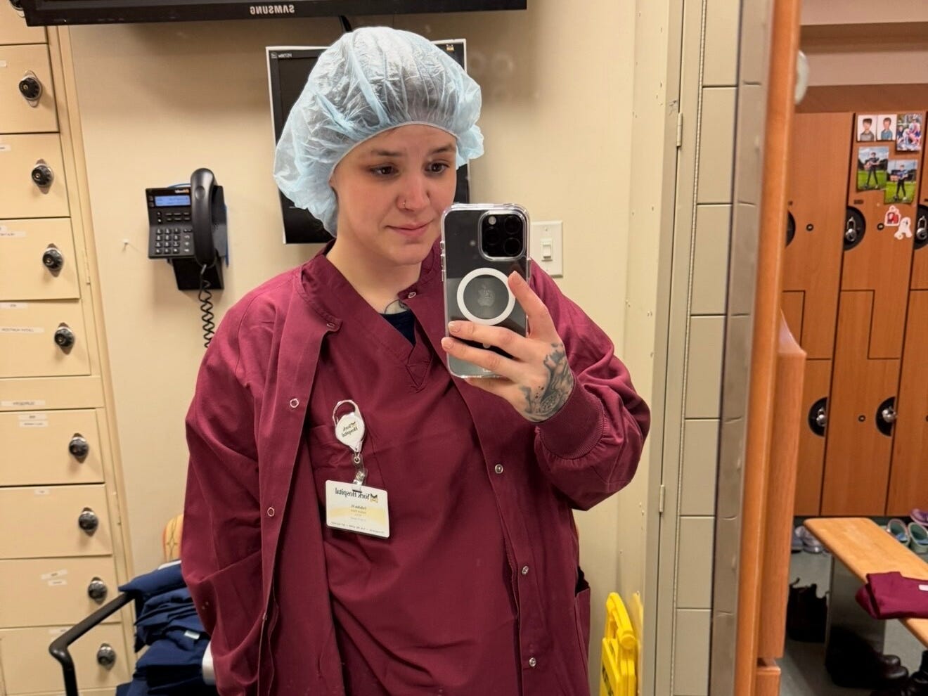 A woman wearing maroon scrubs