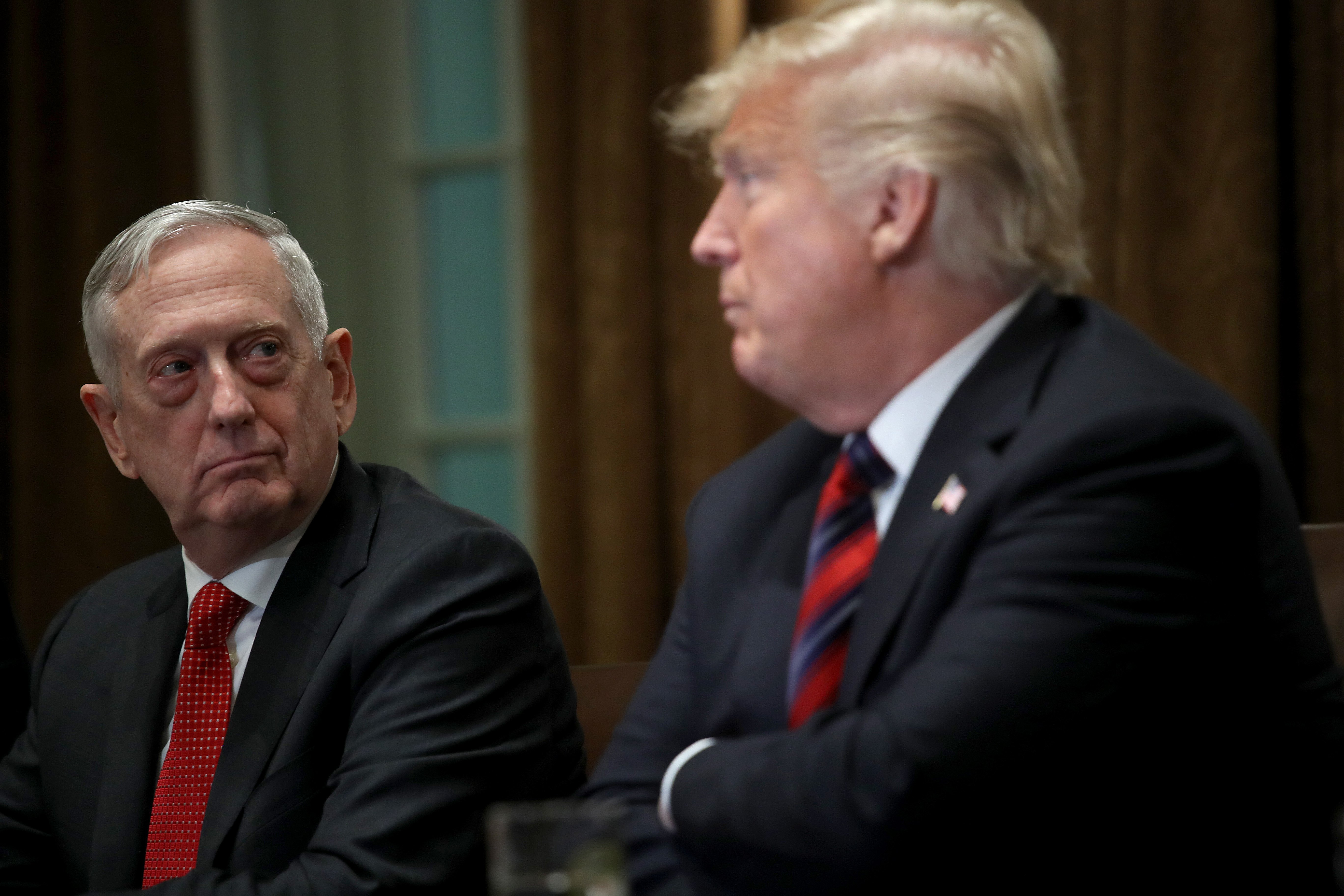 Then-U.S. Defense Secretary Jim Mattis and U.S. President Donald Trump during a meeting with military leaders in the Cabinet Room of the White House in Washington.
