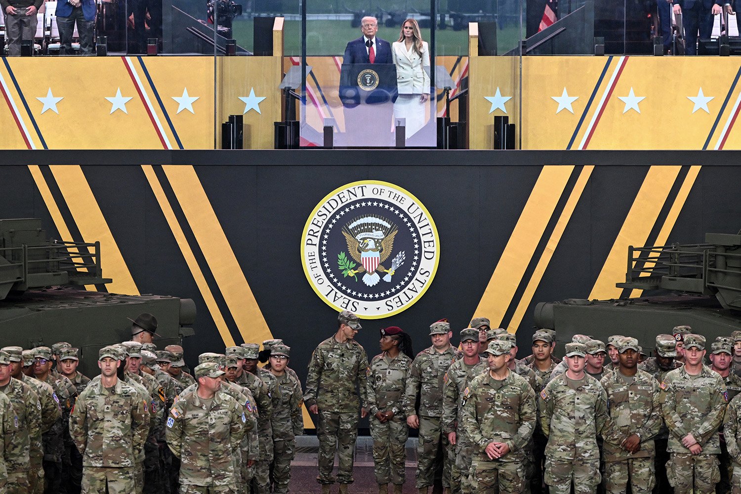 President Donald Trump, center, with first lady Melania Trump, during the Army 250th Anniversary Parade in Washington, D.C.