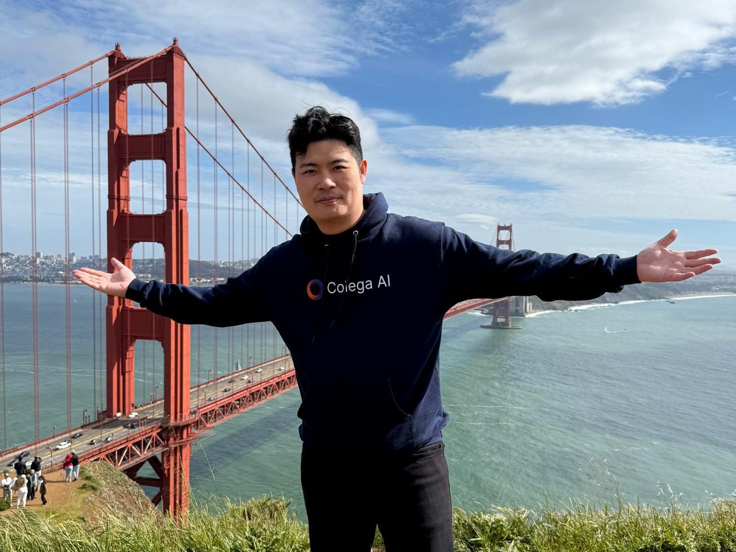 Eric Fung posing with the Golden Gate Bridge behind him in San Francisco.