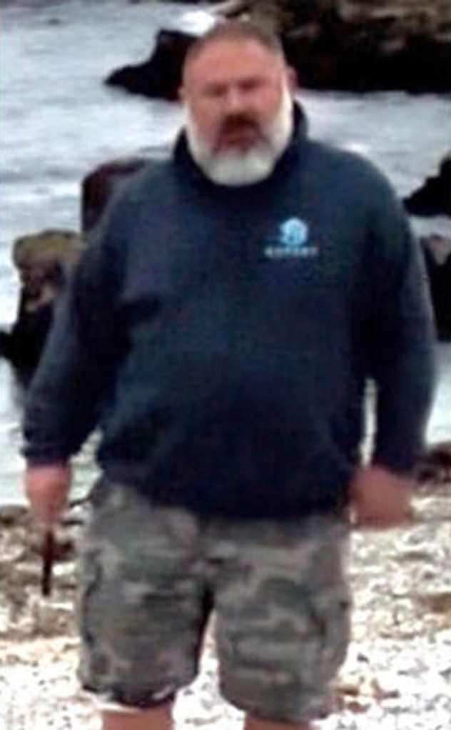 Man with a beard and dark sweatshirt.