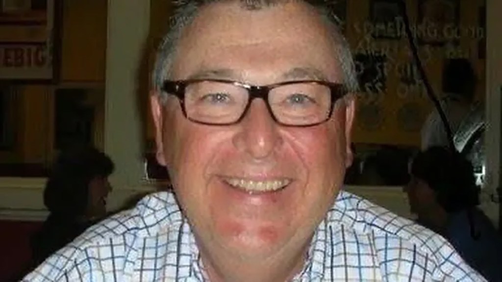 Headshot of John Bond smiling.