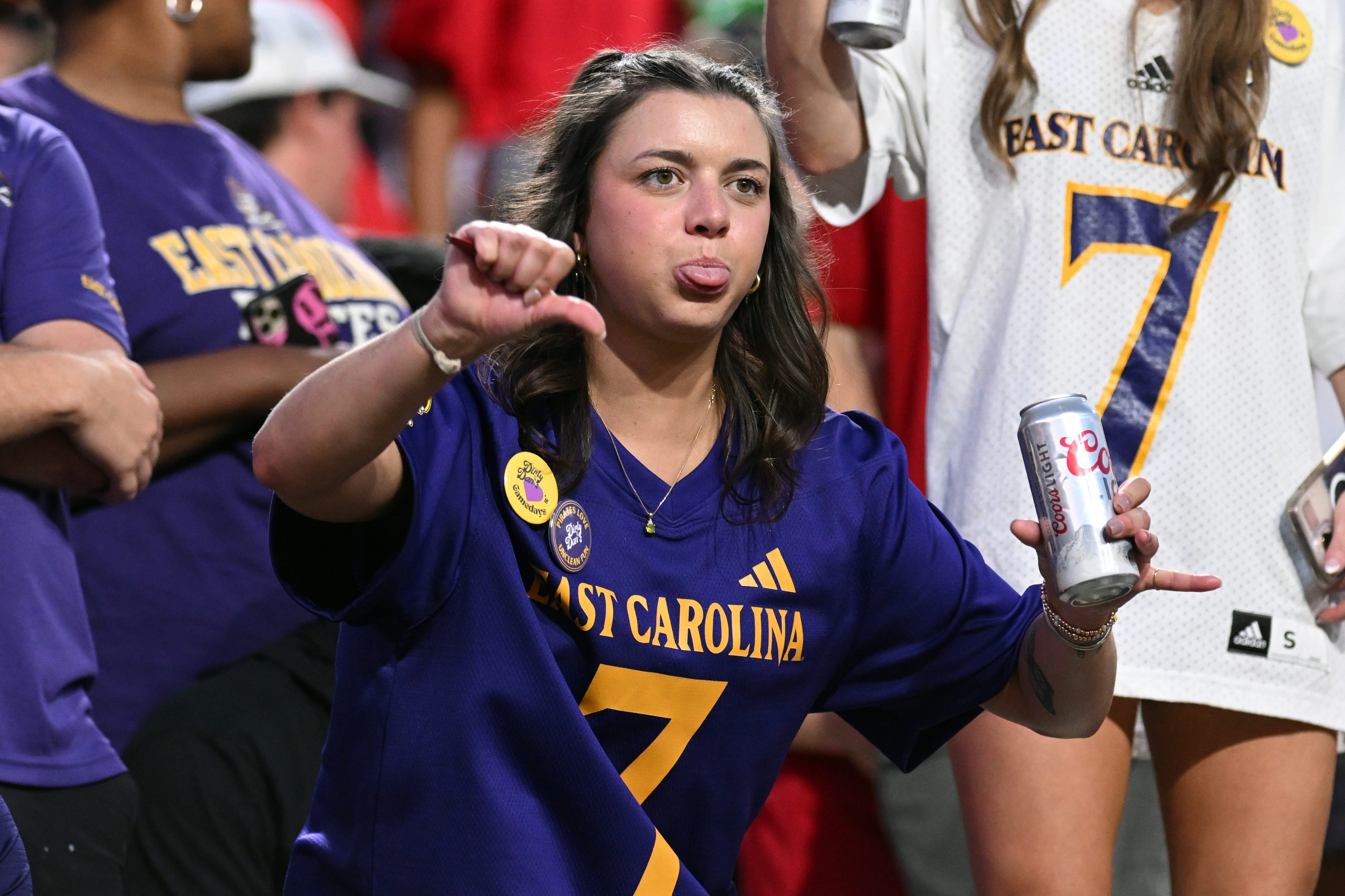 An East Carolina University student holding a Coors Light.