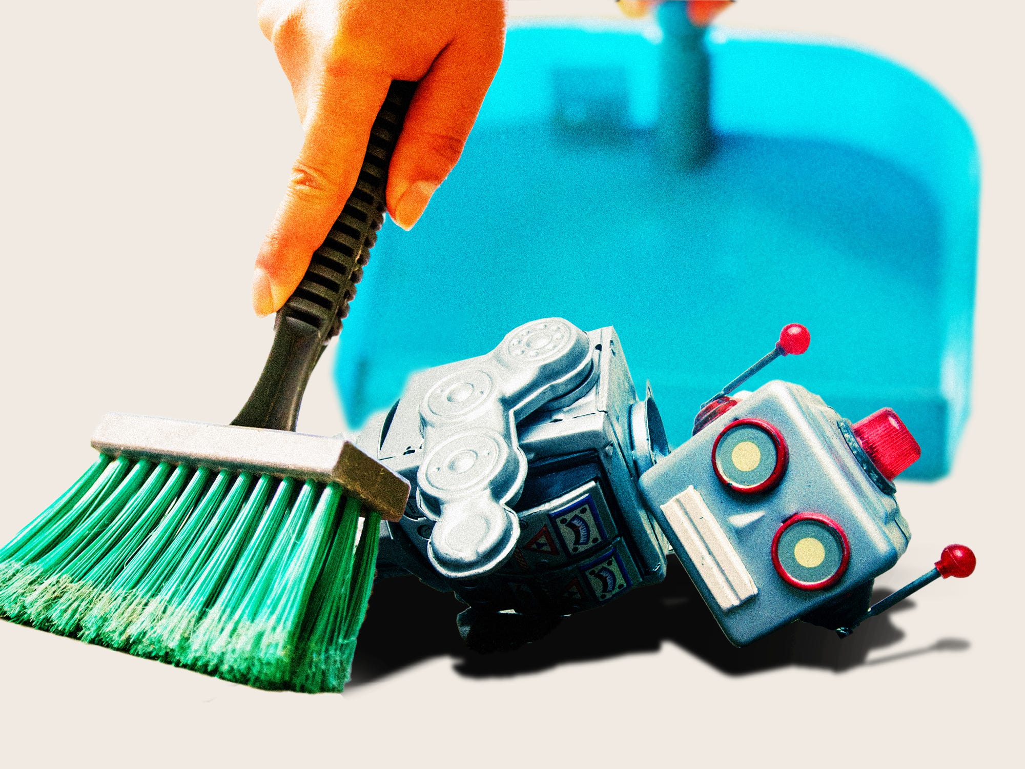 Someone sweeping up a broken robot