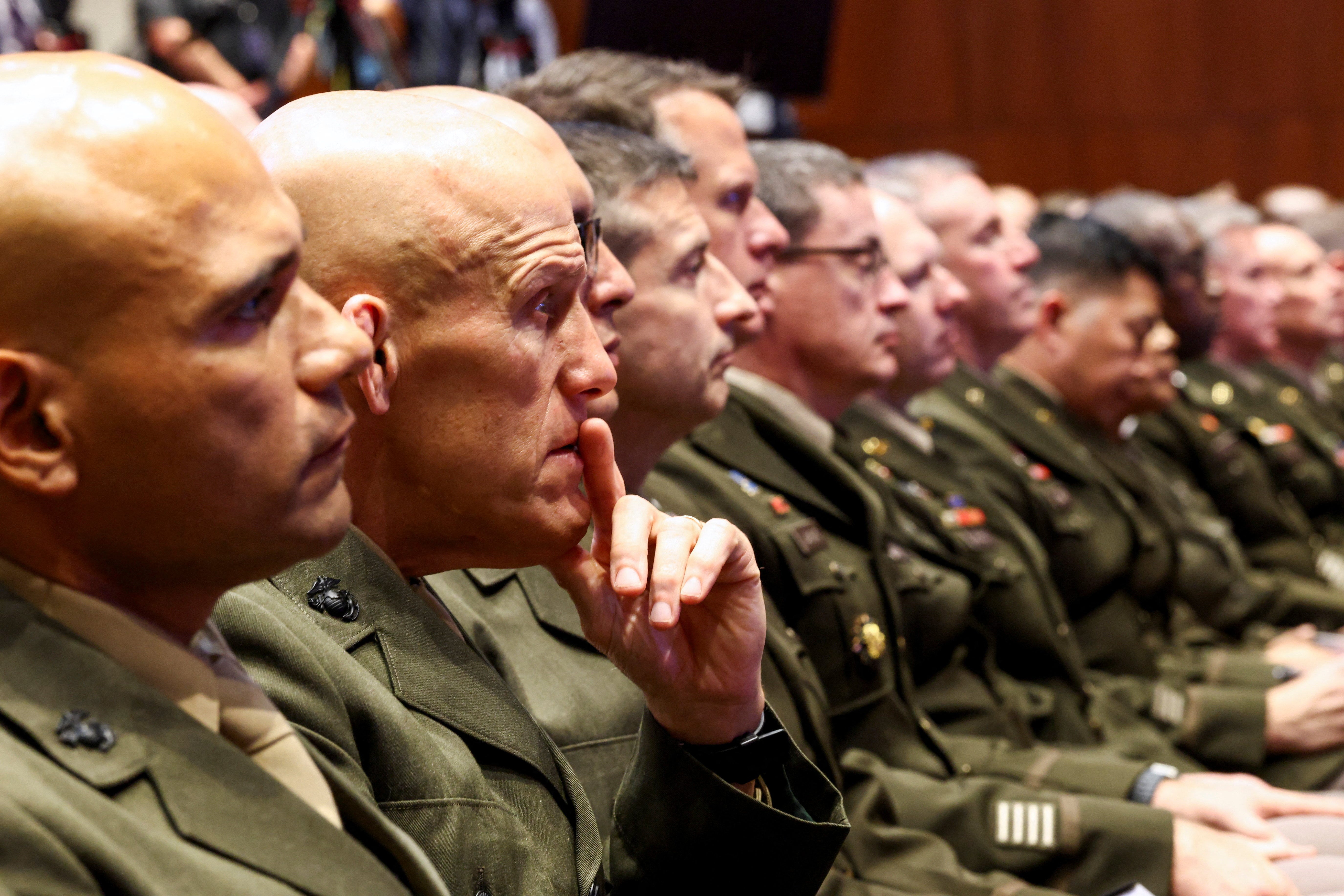 Members of the military attend a meeting convened by U.S. Defense Secretary Pete Hegseth, at Marine Corps Base Quantico, in Quantico, Virginia, U.S., September 30, 2025. REUTERS/Kevin Lamarque