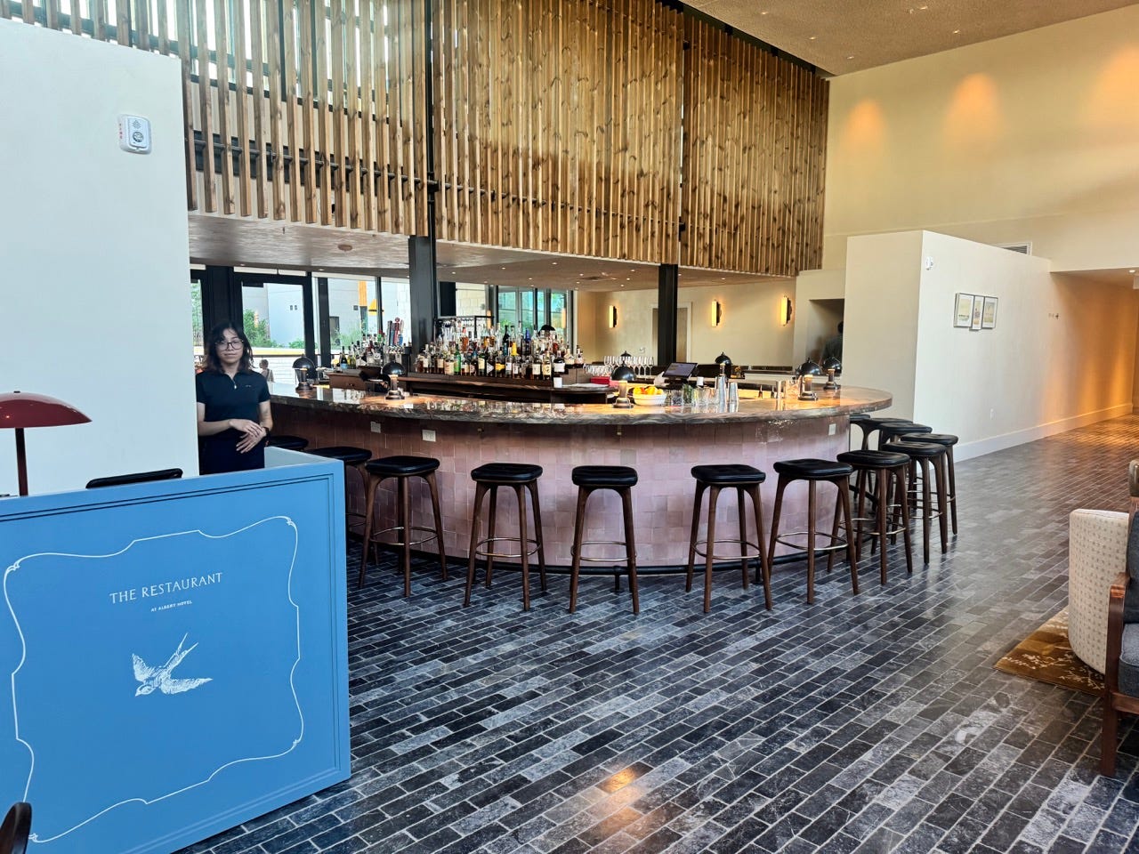 Empty rounded bar area inside The Restaurant at The Albert