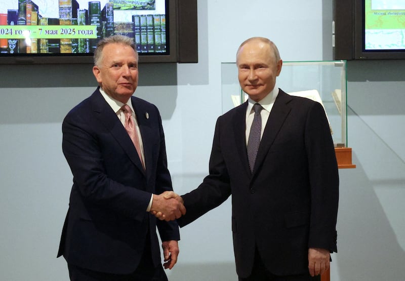 Steve Witkoff shaking hands with Vladimir Putin.