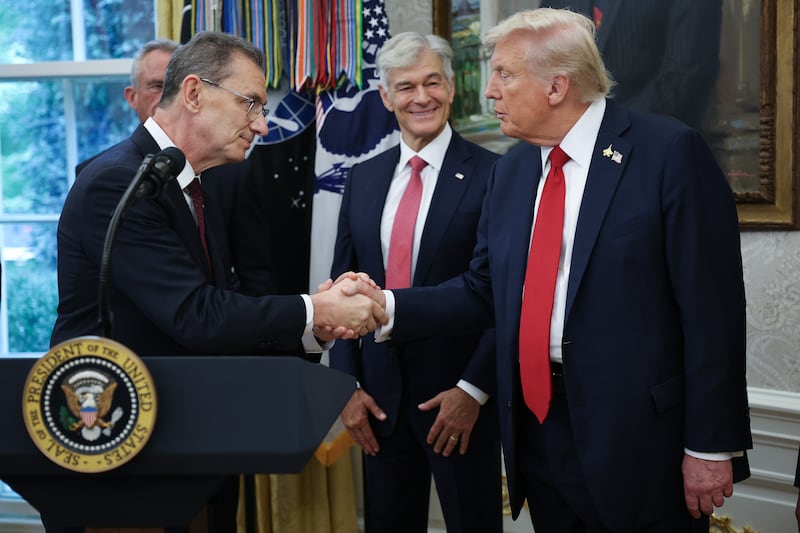 Pfizer CEO Albert Bourla speaks shakes hands with President Donald Trump after they announced a deal with Pfizer to lower Medicaid drug prices in the Oval Office on September 30, 2025.