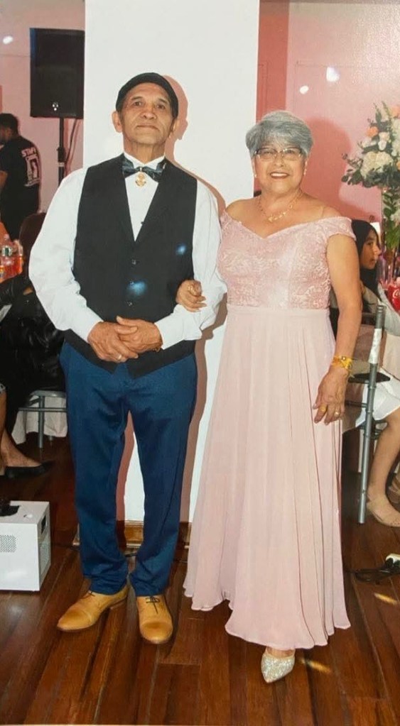 Leobardo Hernandez and Hortencia Hernandez, a couple, pose for a photo.