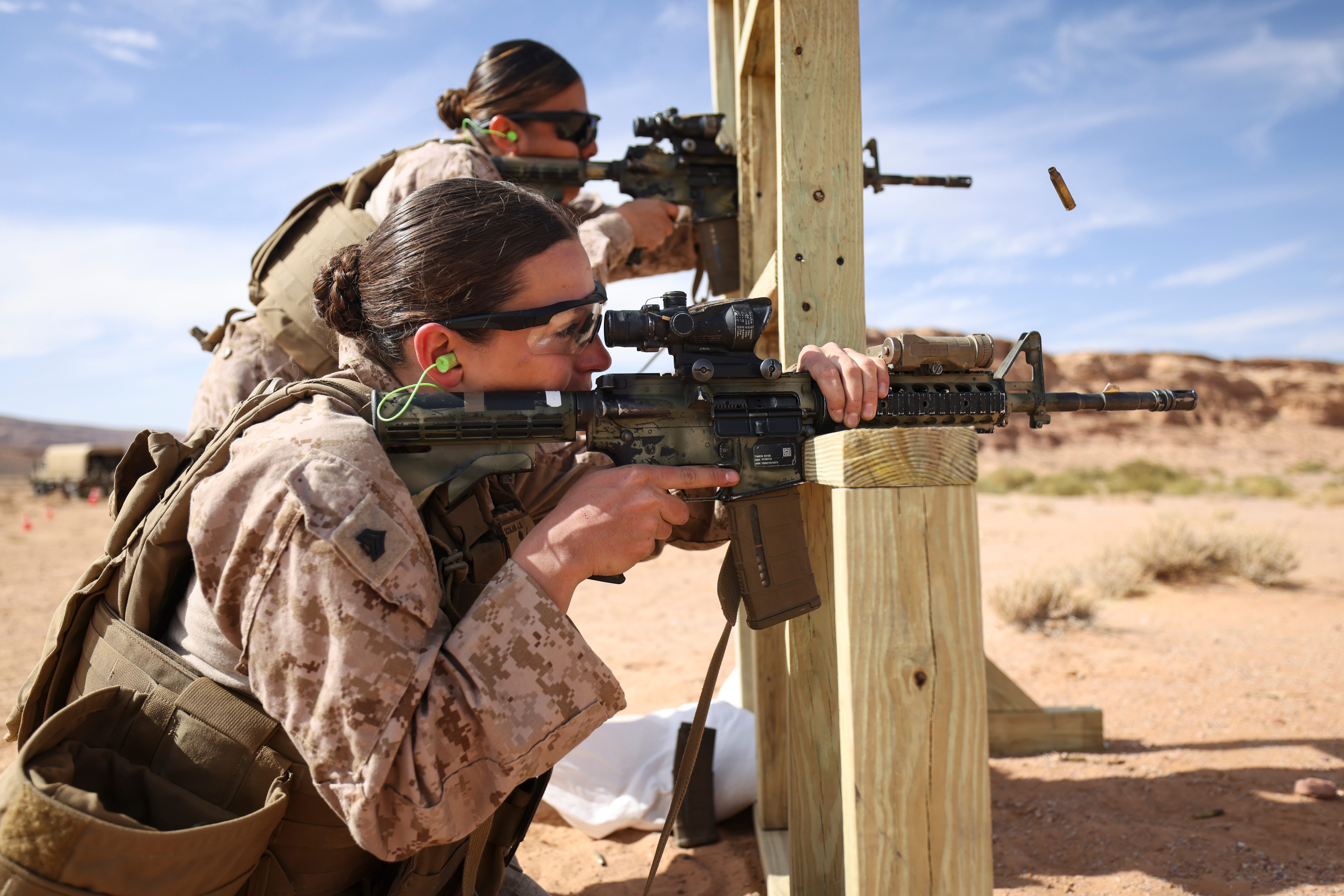 Marines fire rifles during a marksmanship event.